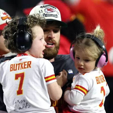Harrison Butker with his to kids photographed at the Super Bowl 2023. 
